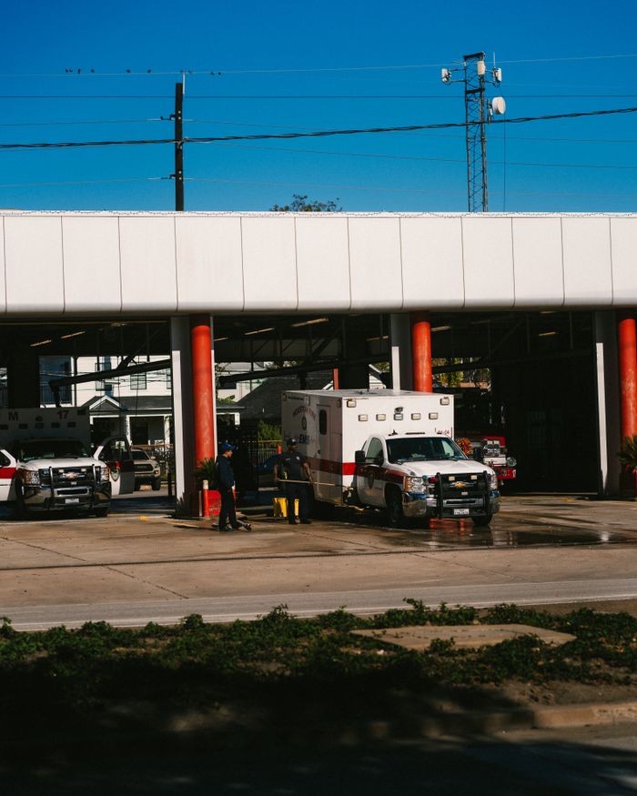 gallery-3 Emergency vehicles parked at a Houston fire station on a sunny day.