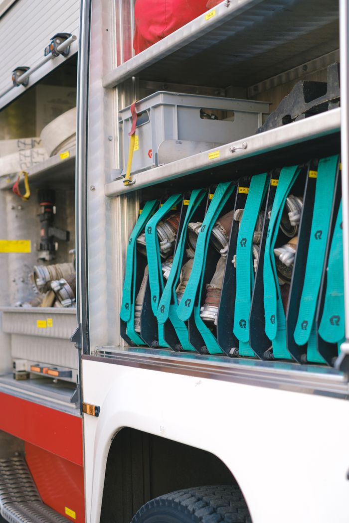 why-choose-us Detailed look at fire truck compartments filled with emergency equipment and tools.